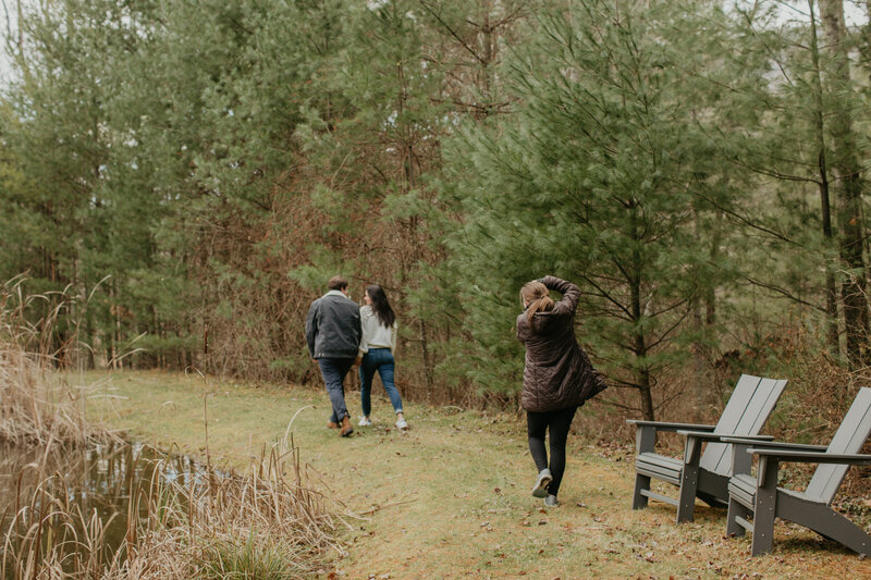 woman taking a photo of a couple