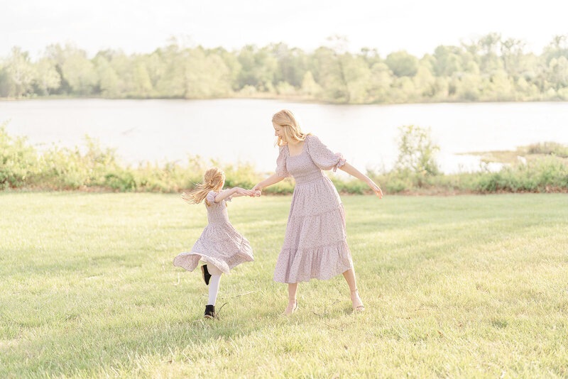 mom twirling daughter in Prince William County, Virginia