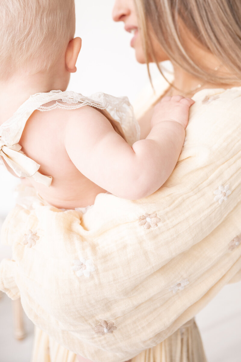 Photo of mom with baby taken by Apex Newborn Photographer