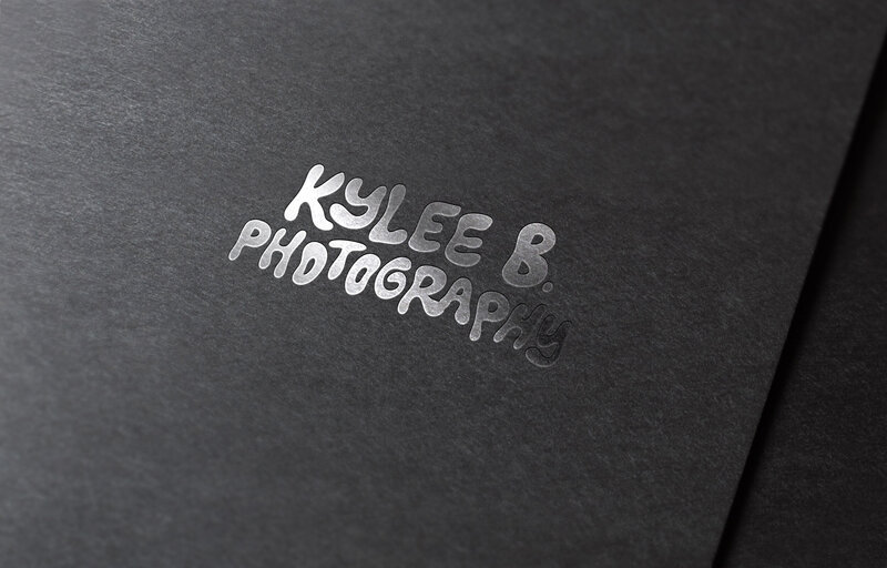 Embossed business card with a logo for Kylee B Photography