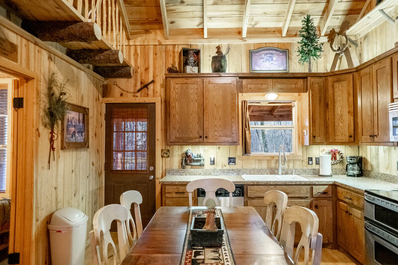 Fully stocked chef's kitchen in Ouachita mountain getaway cabin