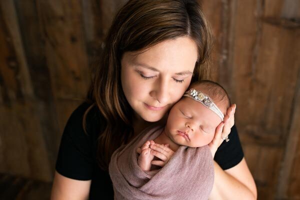 Slinger Newborn Photo session mom posed with baby in studio session | Glory Be Photography by Tara Bos