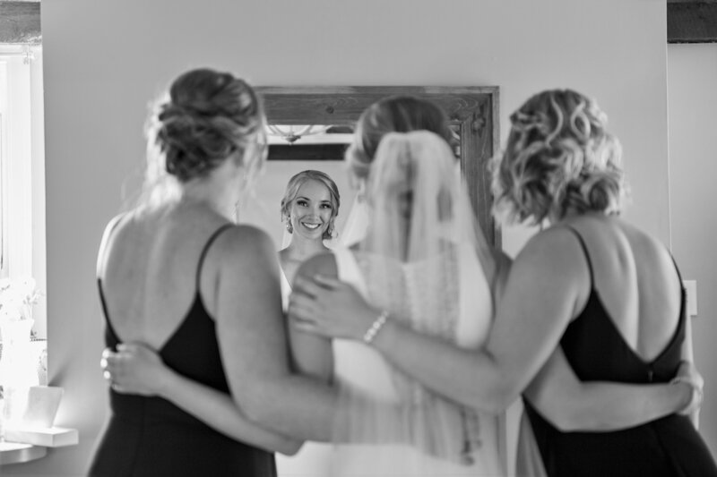 Bride with arms around 2 bridesmaids | Wedding Photography