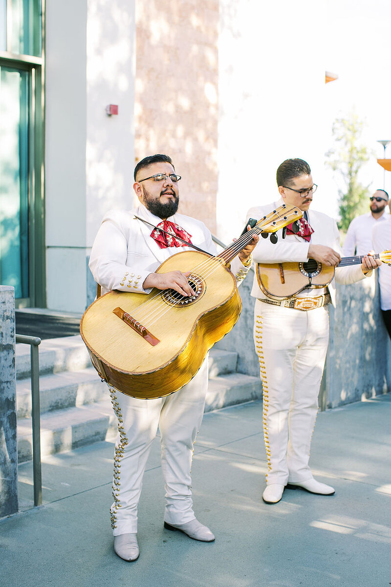 10-radiant-love-events-mariachi-singer-big-guitar-white-outfit-romantic-elegant-timeless