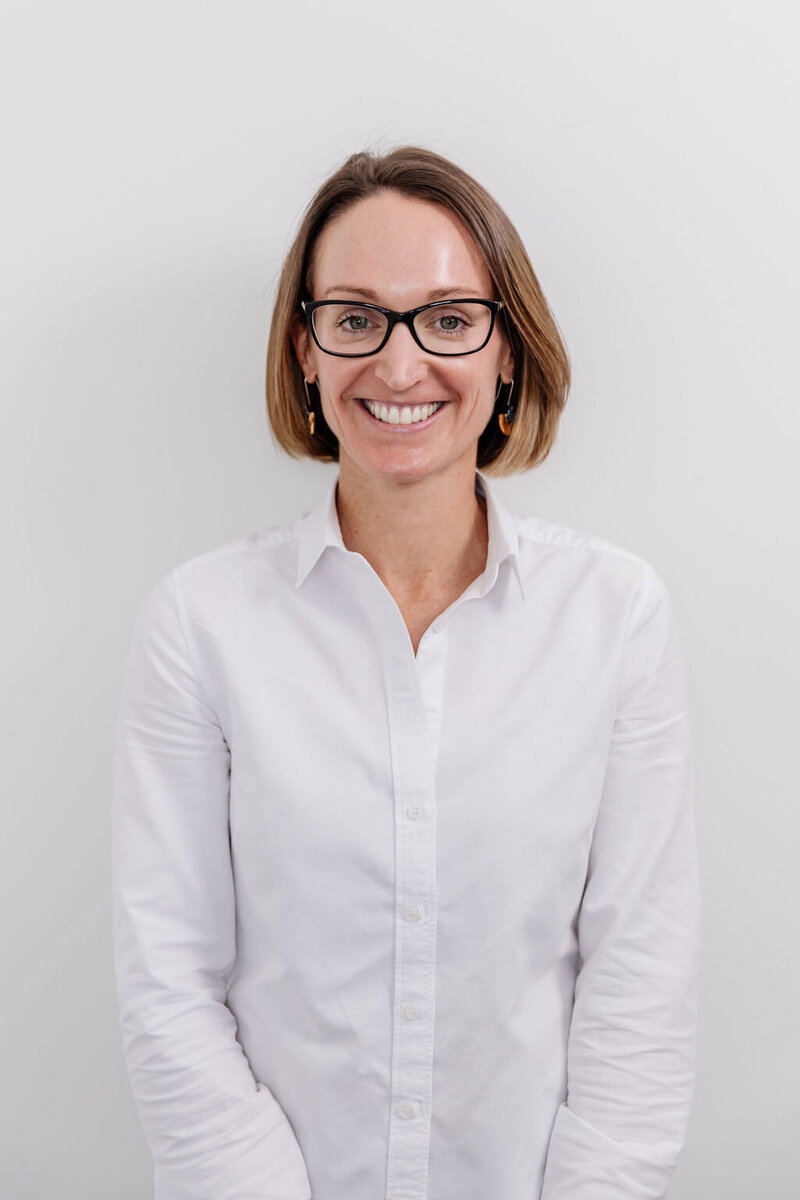 Sarah smiles and poses at Headstrong Psychology in Malvern East