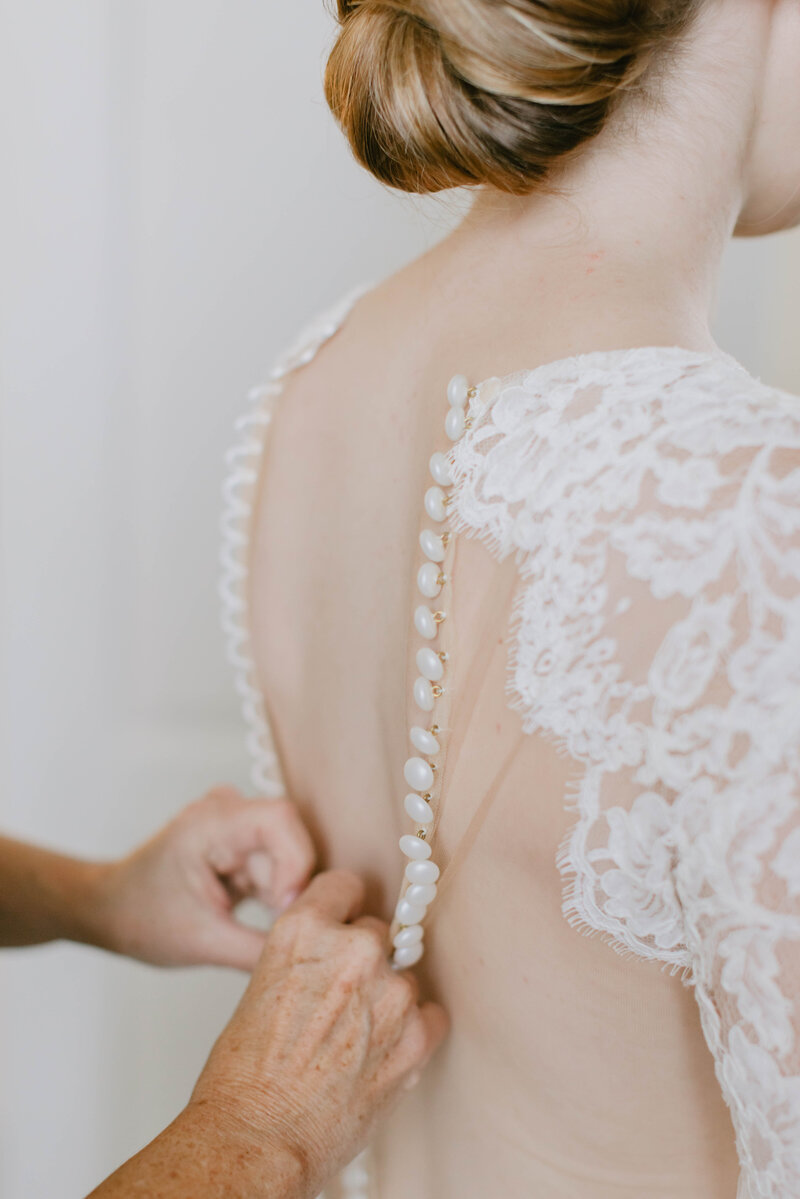 delicate lace details on back of wedding dress