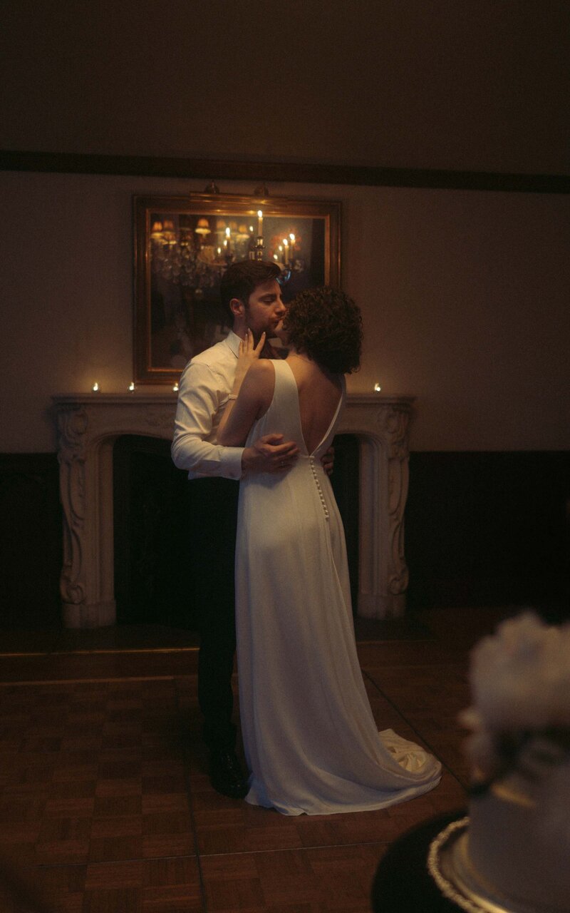 Couple dancing in the evening reception, enjoying their first dance surrounded by glowing lights, creating unforgettable memories in a romantic atmosphere