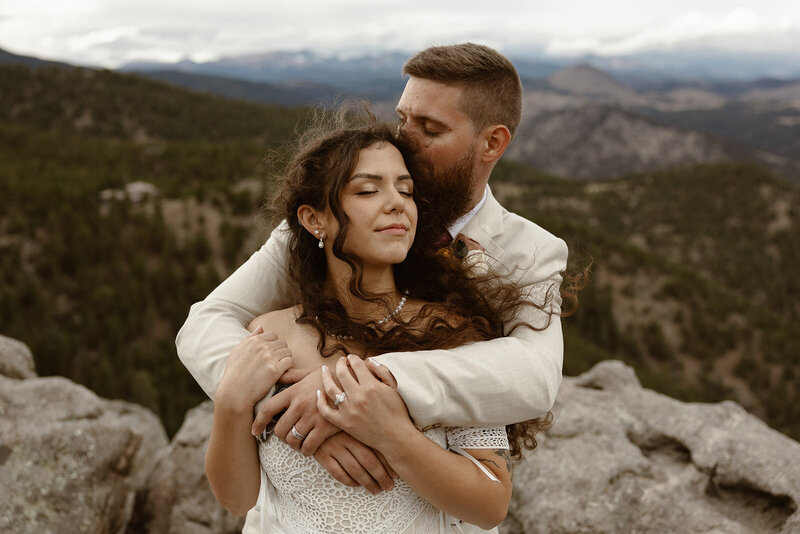 couple embracing after their elopement in boulder colorado