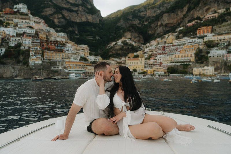 bride and groom on boat in positano