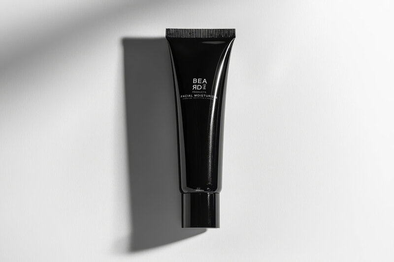 Black tube of Beard One Products facial moisturizer on a white background