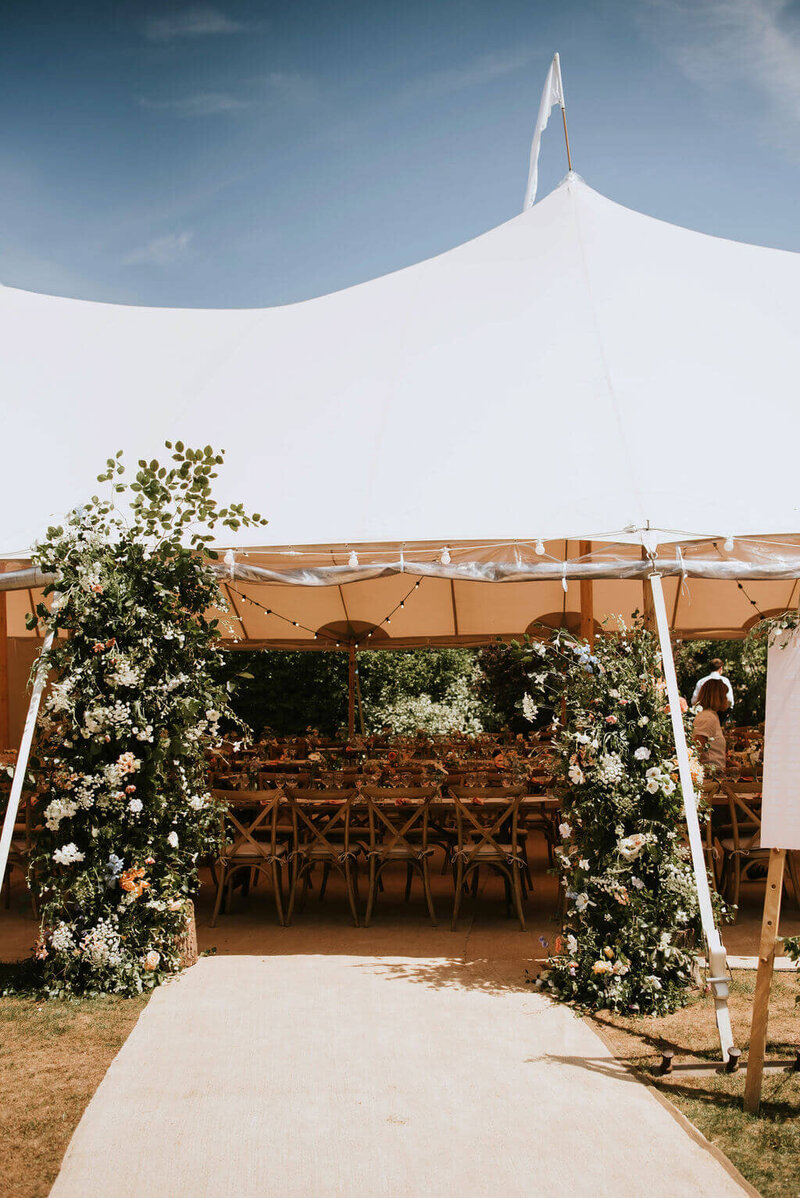 Floral entrance to the marquee wedding at Broadfield Court