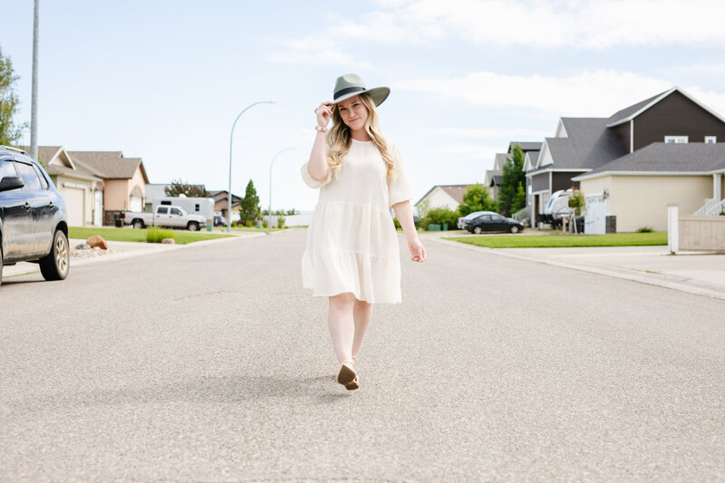 Realtor Tamara Rzan walking through a small town