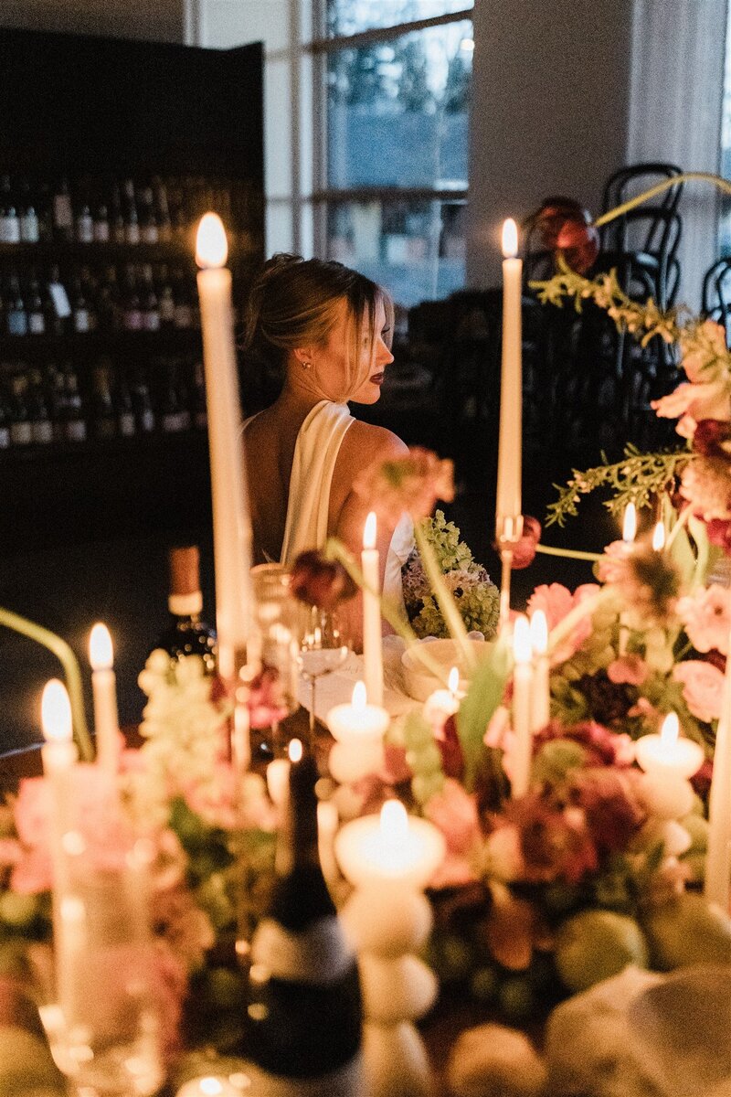Modern baroque wedding table with sculpture, candles, and hellebore