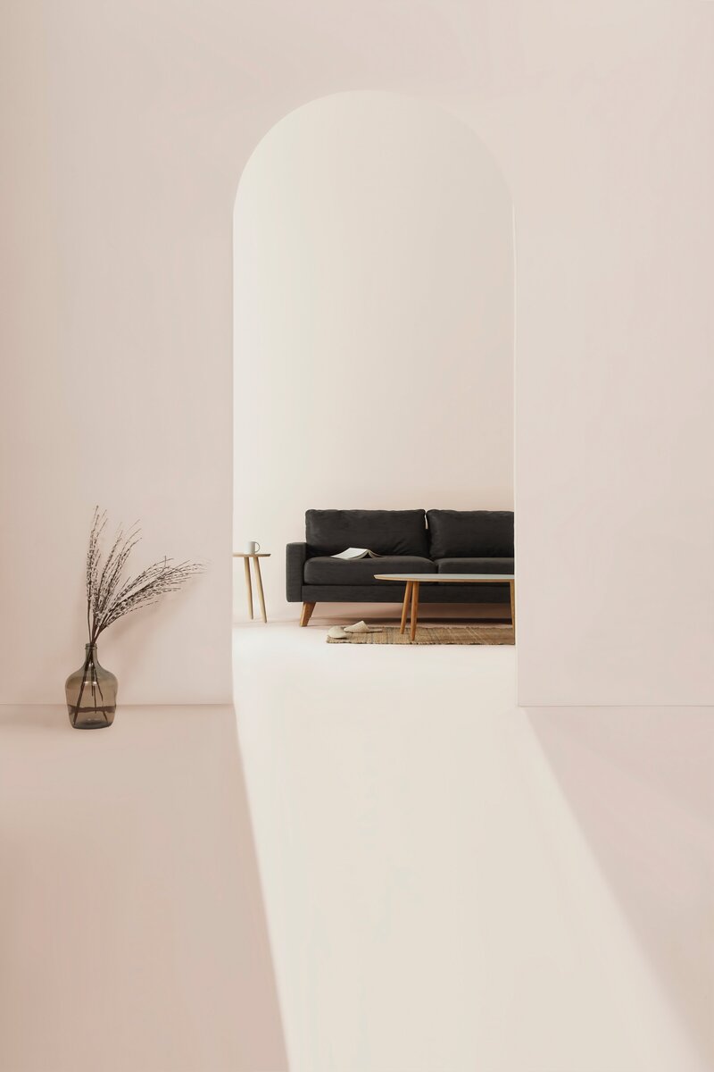 A light living room with a sofa and a plant