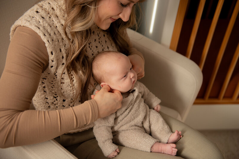 side view of craniosacral therapist working with baby