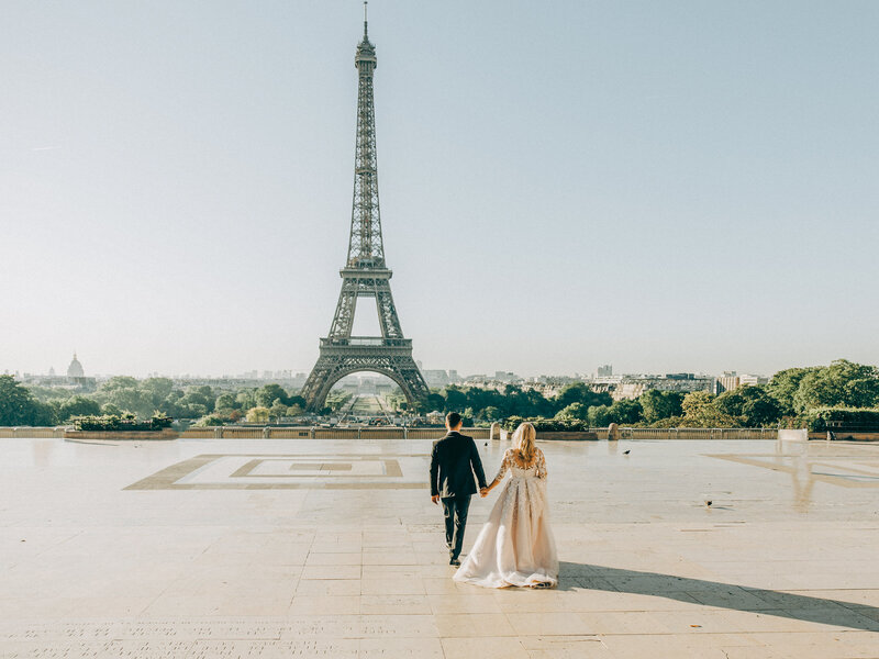 Bride and Groom Pre wedding walking to the Eiffel Tower in Paris