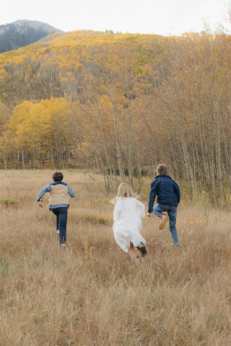 Authentic candid family photography in Aspen — child’s playful moment styled in elevated mountain fashion.