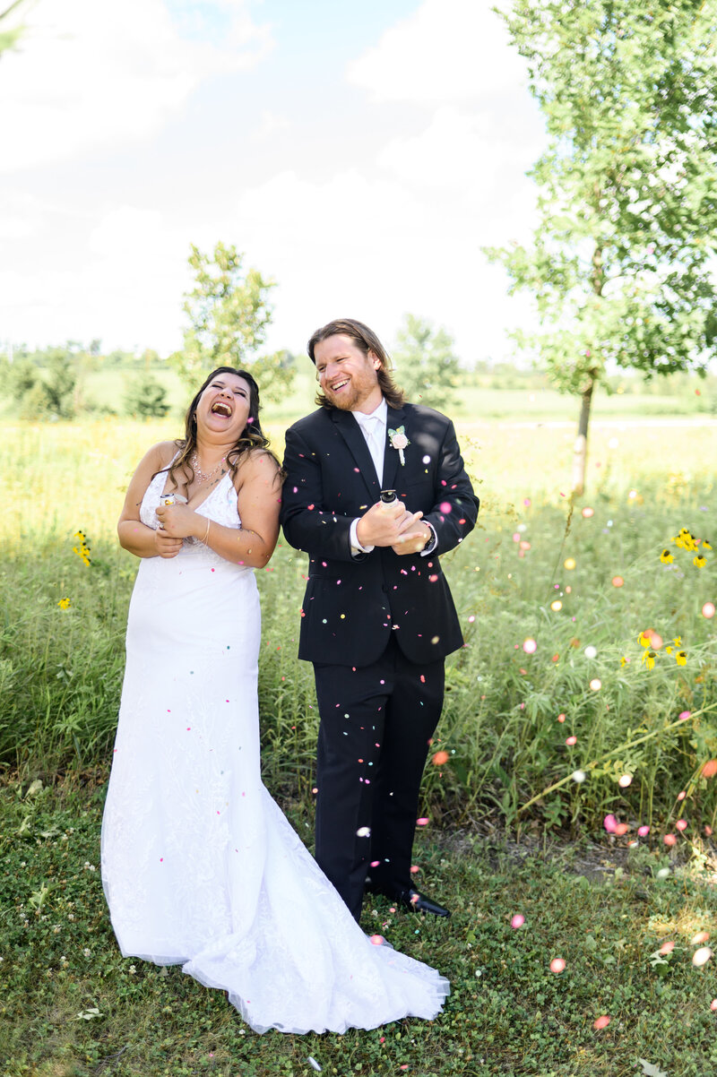 Bride and Groom toasting to a kiss  at their luxury  sweet heart table