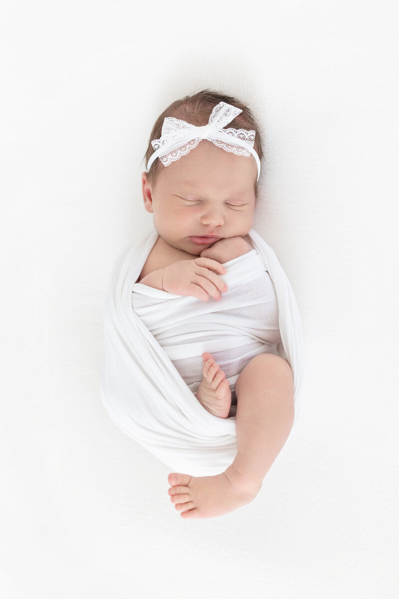 Sleeping newborn on beanbag in studio