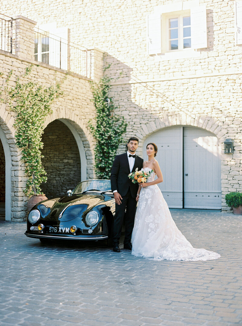 Wedding Portraits at Airelles La Bastide de Gordes Bride and Groom with Porsche speedster 356 Luxury style