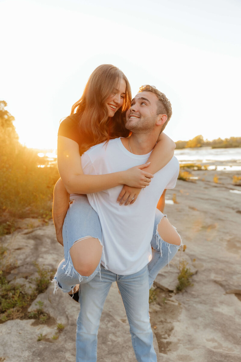 Michigan couples photographer capturing playful and romantic golden hour portraits for adventurous pairs who love real, candid connection.