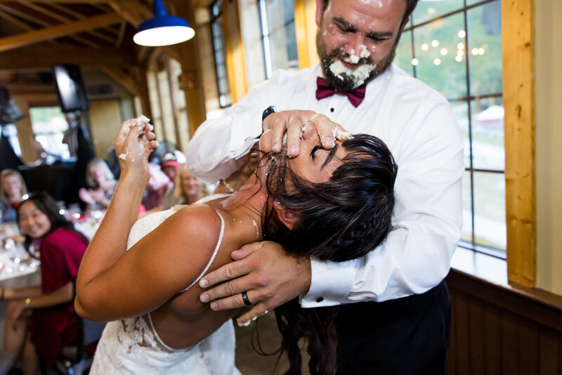 wedding-bride-groom-reception-candid-cake-fight-schweitzer