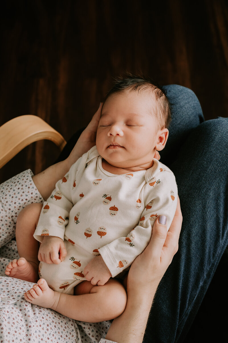 Newborn baby in cute onesie 