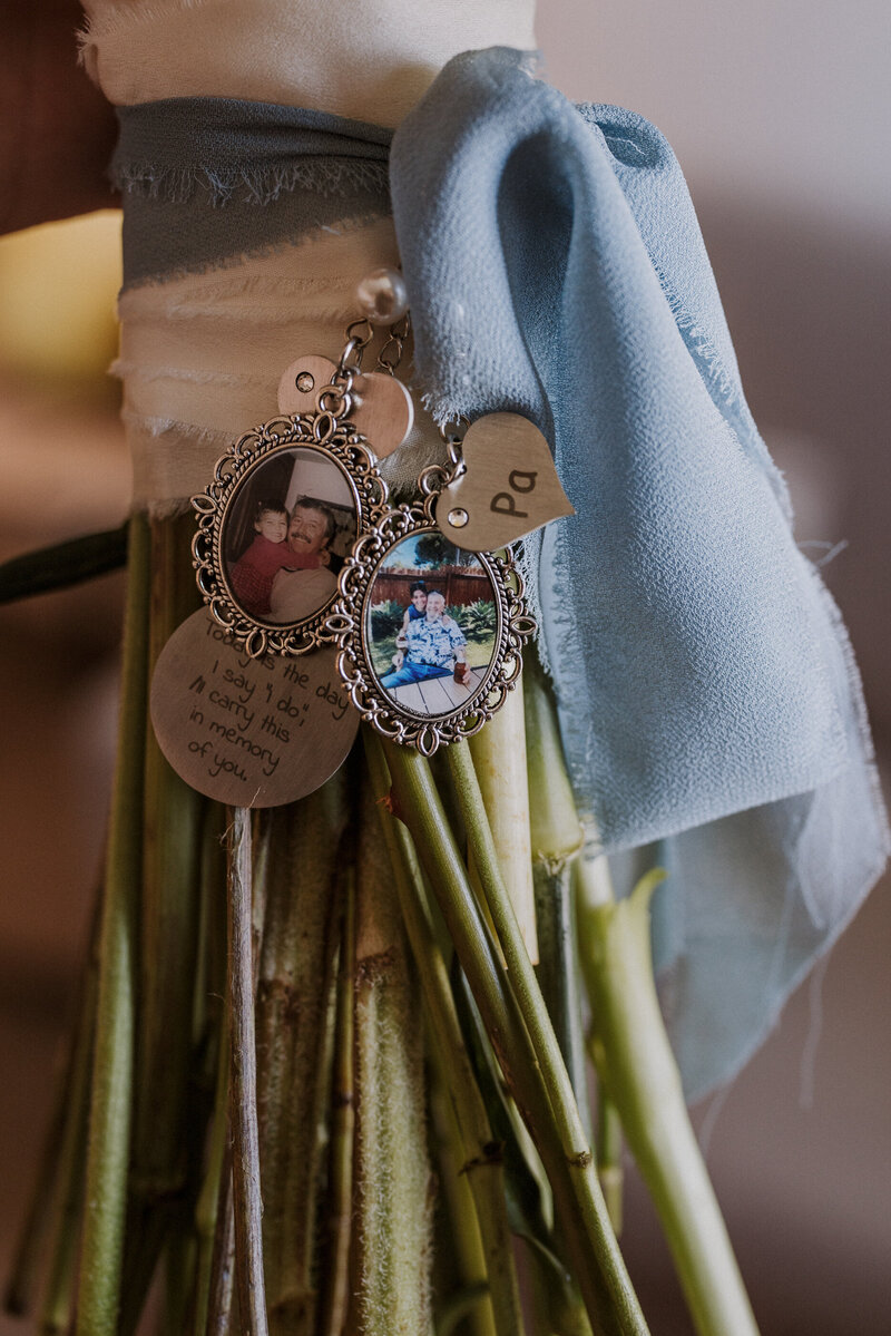 bride's nostalgic charms on her bouquet