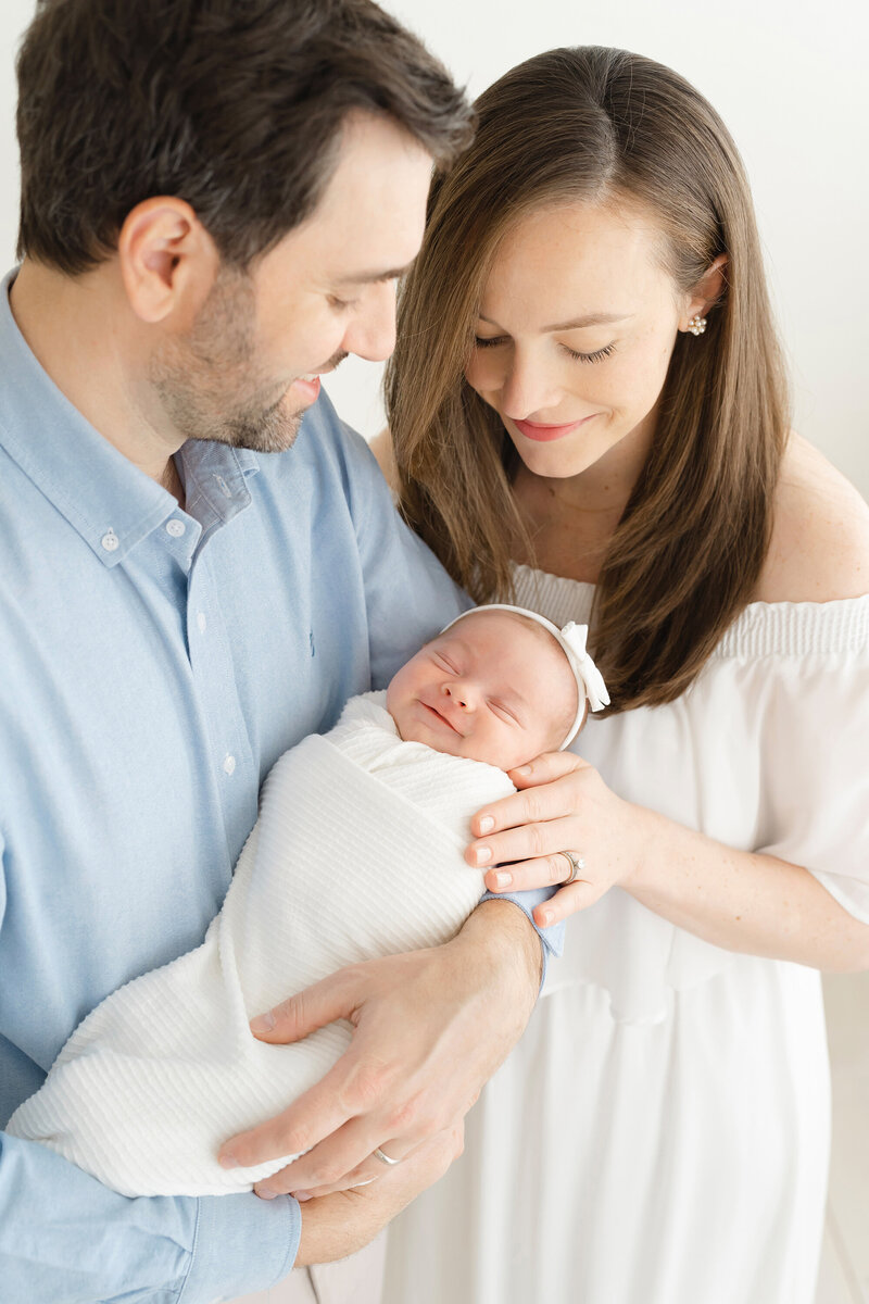 Parents holding new baby girl for louisville portrait photographer