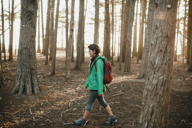 woman walking in woods - Outdoor Podcast for Women