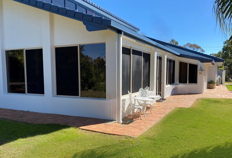 Stylish home featuring awning windows for improved airflow and energy efficiency.