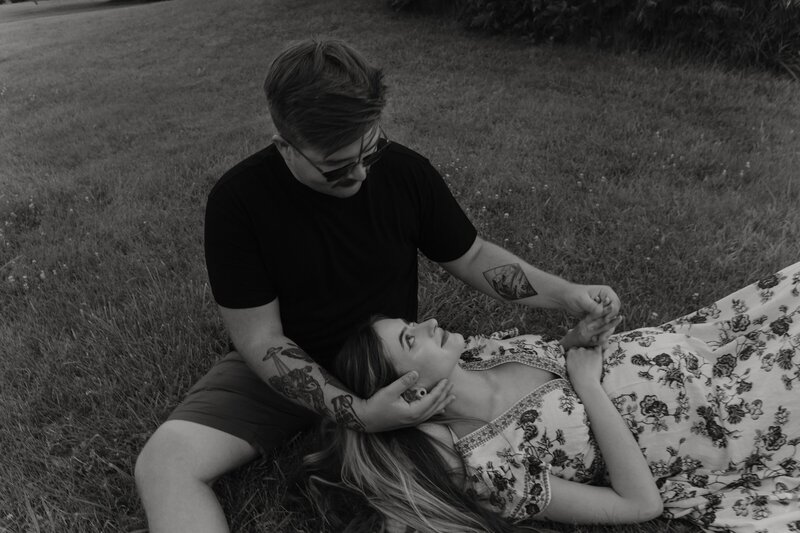 couples maternity photos in tall grass field in michigan