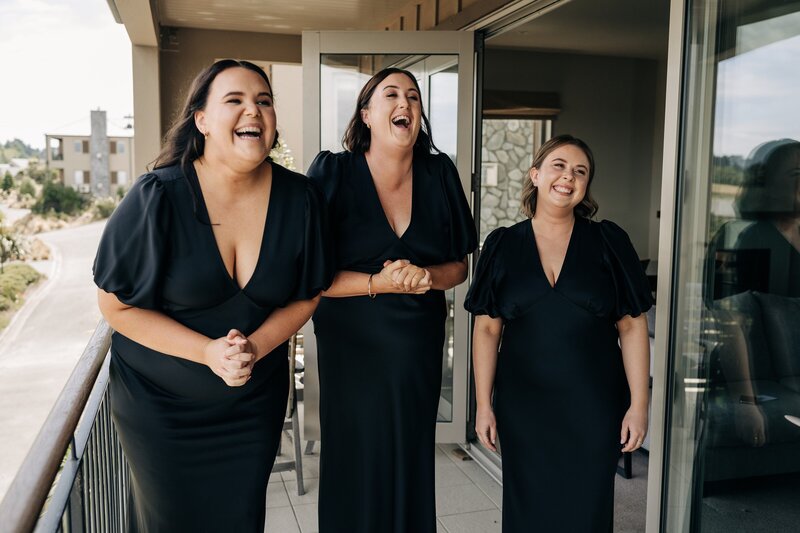 three bridesmaids in black ruby kendall dresses on a wedding morning