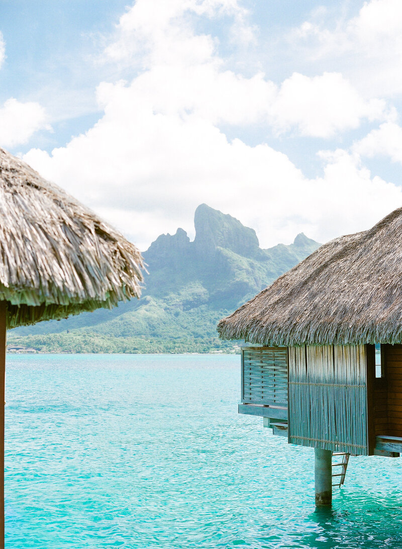 Overwater bungalow blue lagoon and the Mount otemanu with vibrant colors the morning