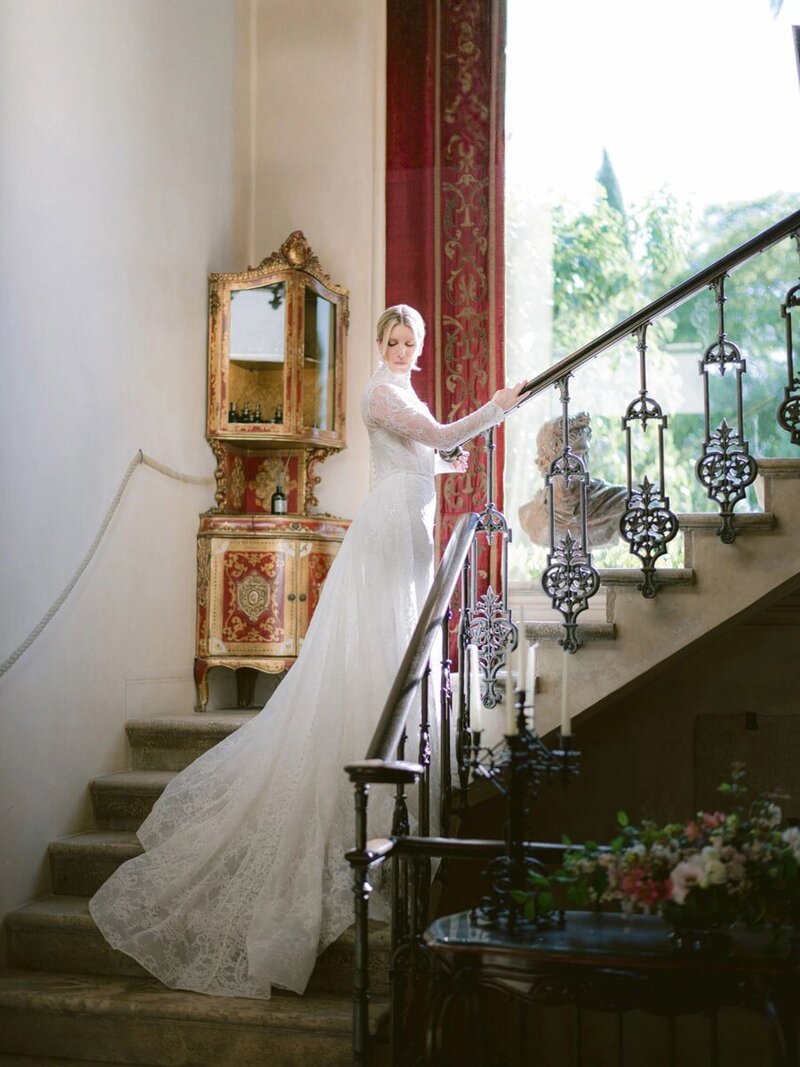 Bride on old staircase during a wedding at Borgo Santo Pietro