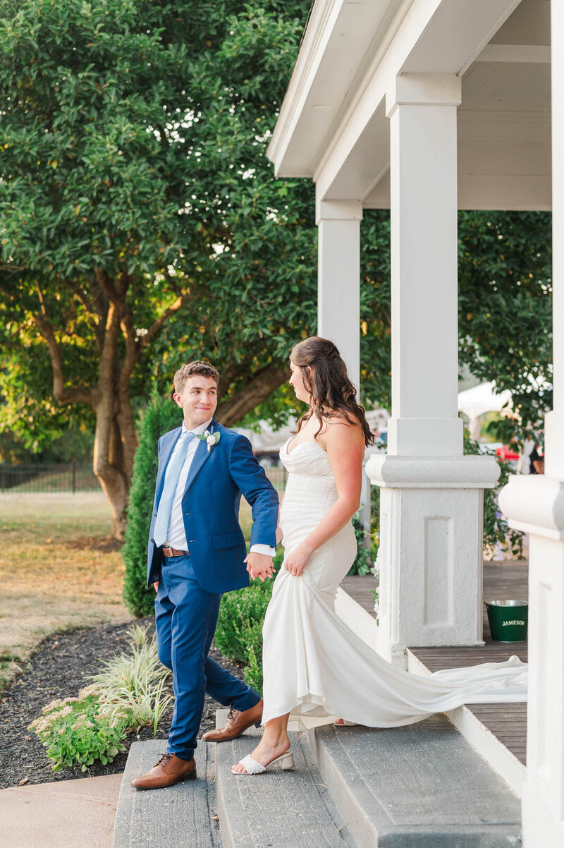 Bride and Groom walking down the stairs on their wedding day at The Presley House