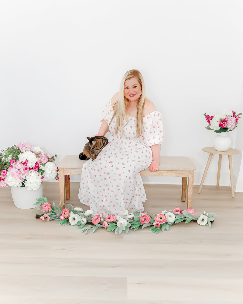 woman hugging a tabby cat