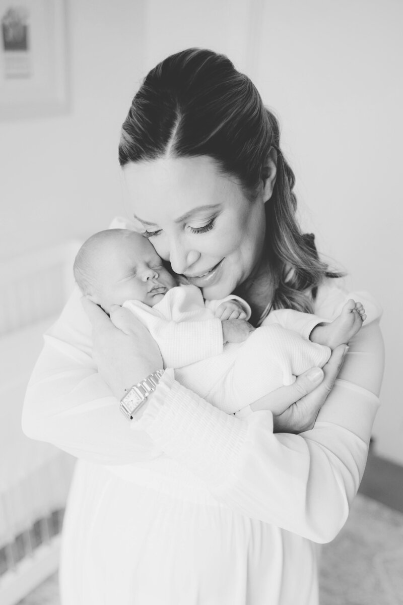 Mom cuddling baby in black and white by Northern Virginia Newborn Photographer