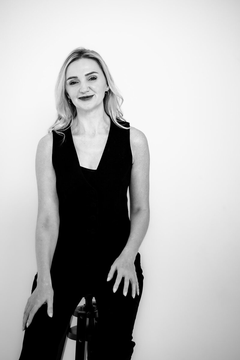 Black and white picture of a women sat on a chair