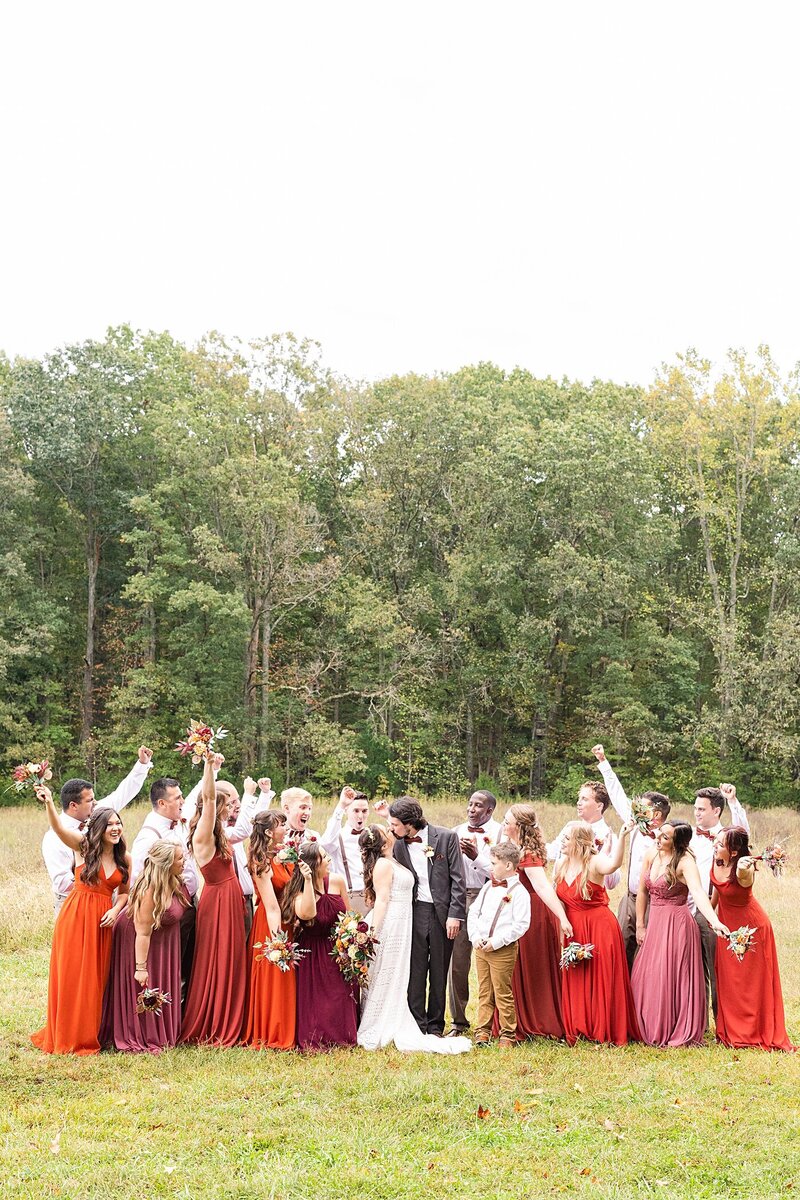 Bridal party photo of everyone cheering on the bride and groom  at Avonlea Farms in Richmond, Virginia.