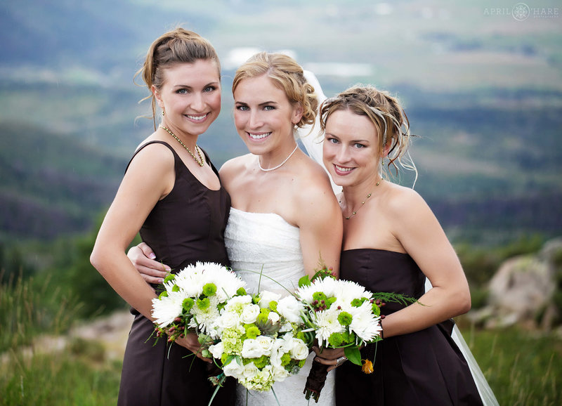 Summer wedding bride photo with her sisters at Steamboat Springs Ski Resort in Colorado