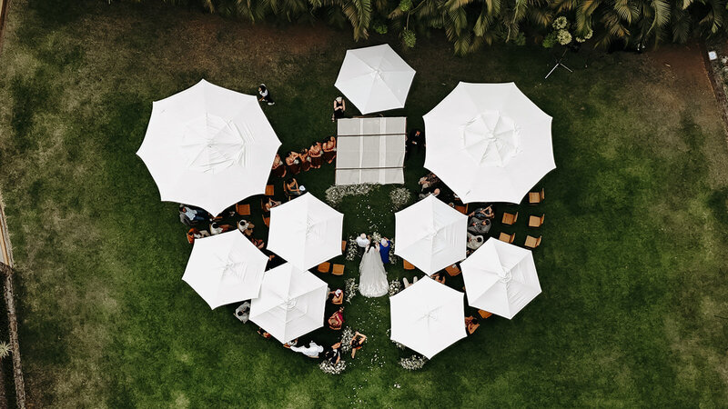 Drone view of a bride walking down the aisle in destination wedding
