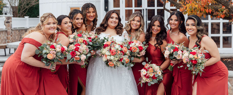 Bride and bridal party standing together outside the venue | The Farmhouse Wedding | Hampton, New Jersey