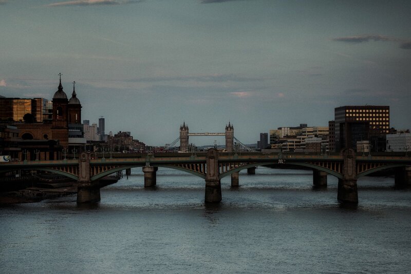 Sunset view of Tower Bridge and the city skyscrappers in the background