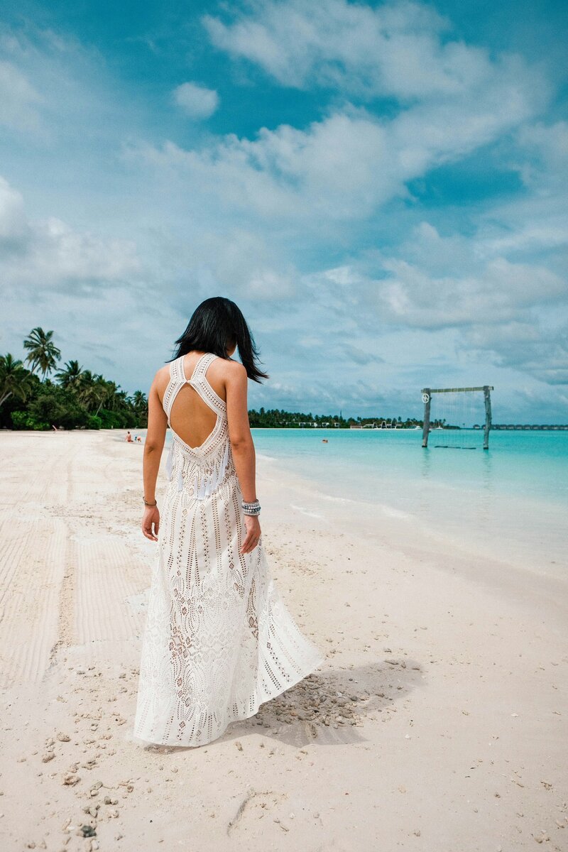 Woman on white sand beach