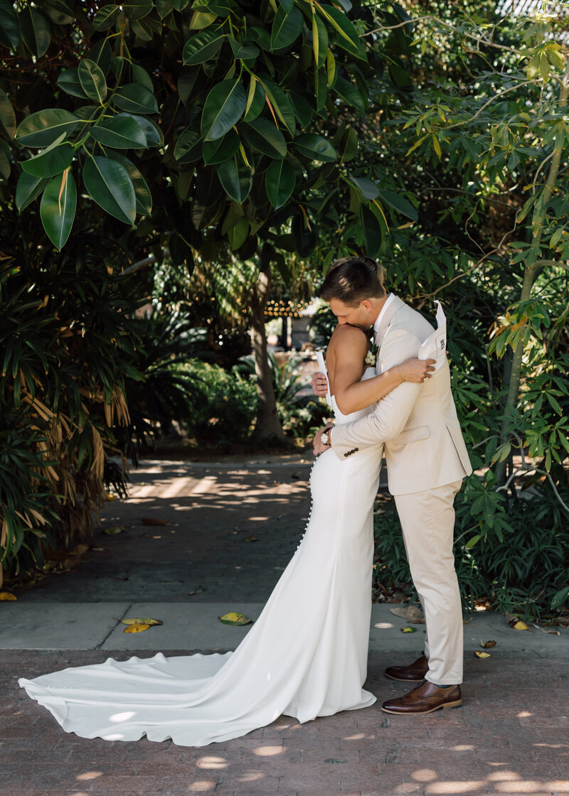 Bride and groom hugging after exchanging heartfelt vows captured by a Phoenix Wedding Photographer