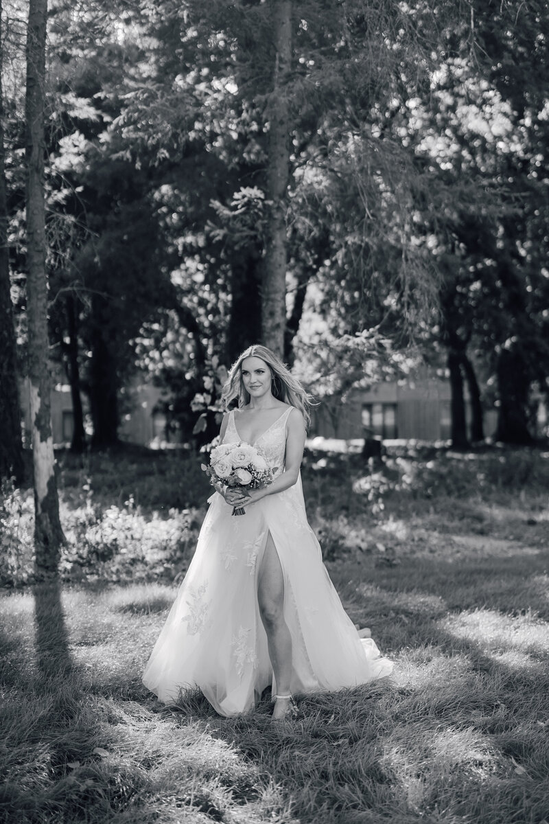 bride-with-beautiful-white-bouquet-and-spilt-in-dress