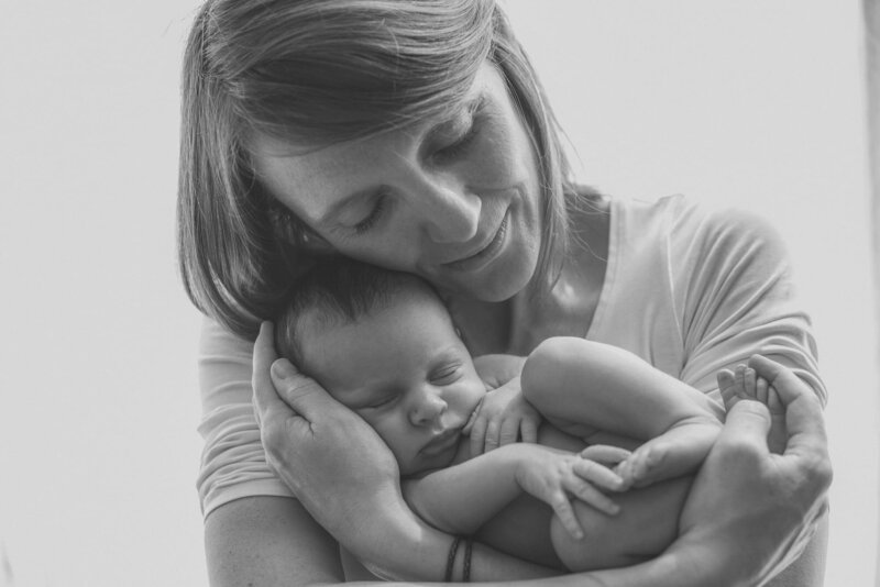 Mother holding her baby with love and care. 