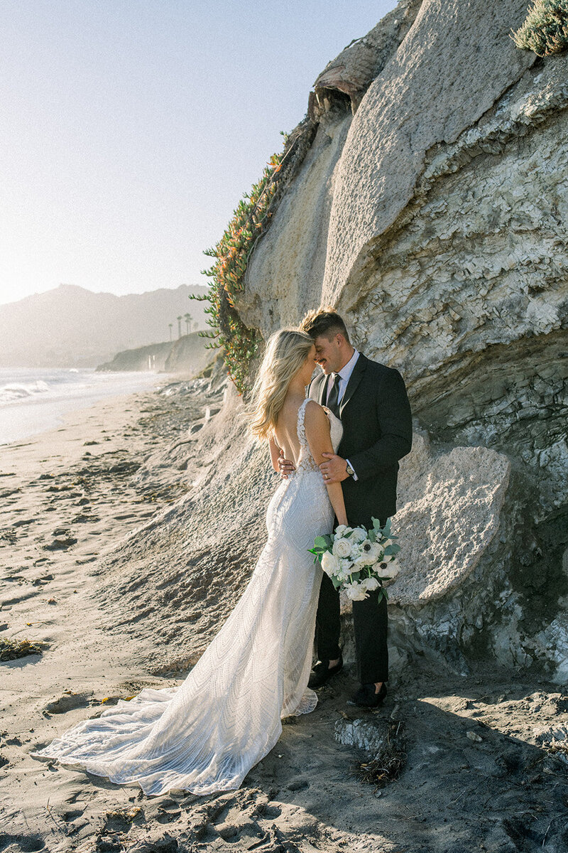 Bride and groom on the beach Dolphin Bay Resort wedding in Pismo Beach, CA