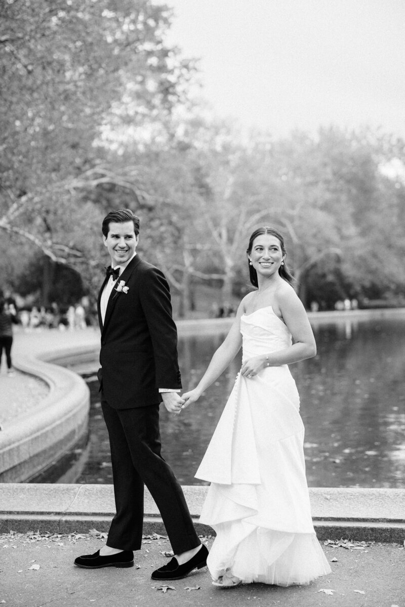 Bride and Groom walking through Central Park